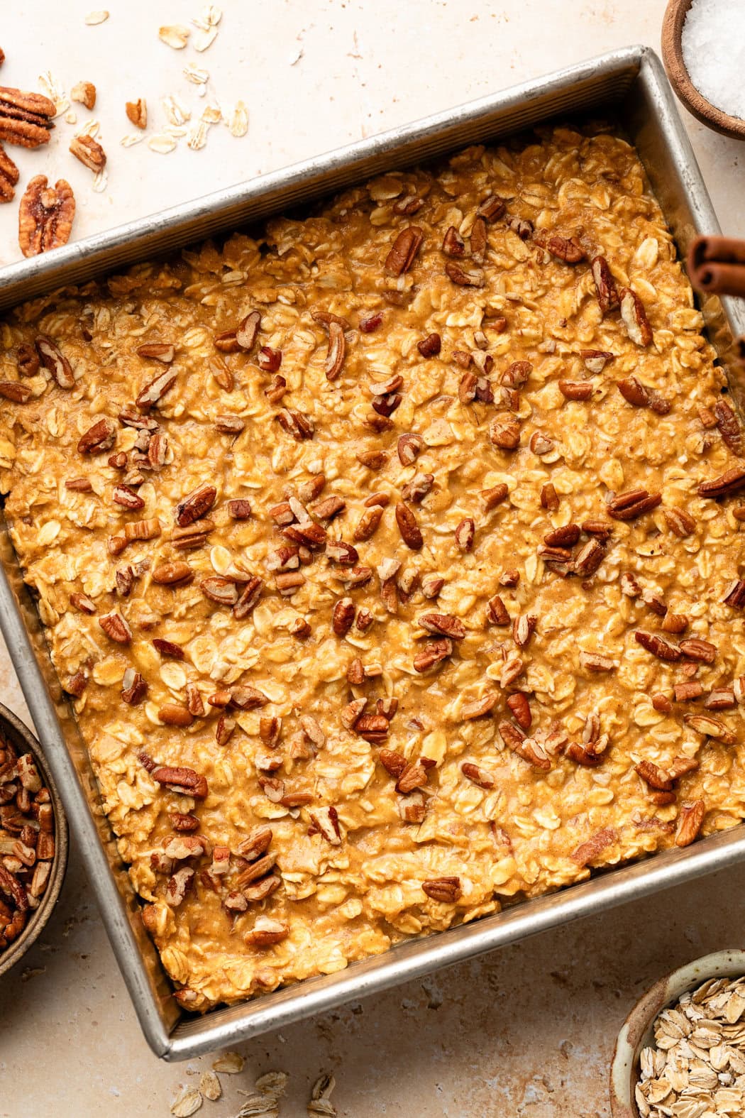 Overhead view of a pan of Pumpkin Baked Oatmeal ready for baking. 