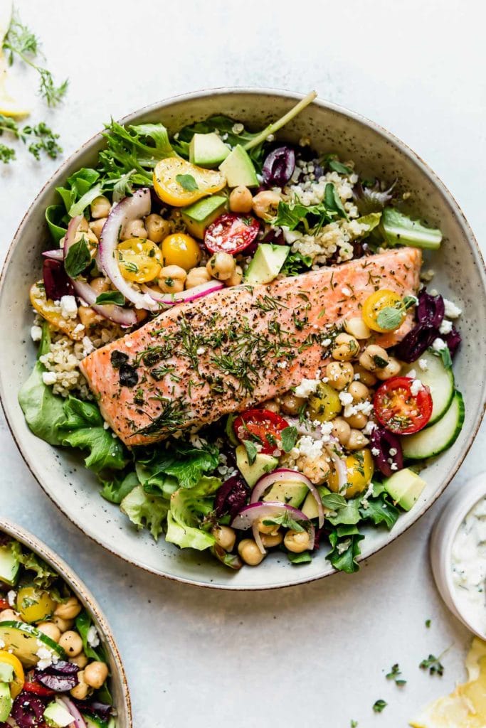 Mediterranean Bowl with Salmon in a light colored bowl. 