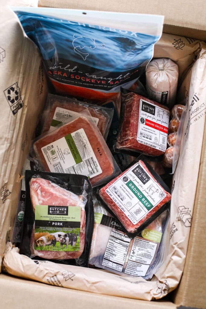 Overhead view of a box of butcher box meats. 