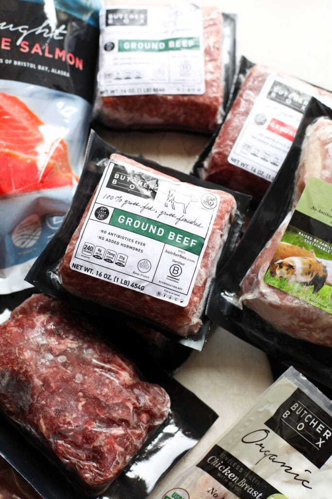 Close up view of a variety of butcher box meats including ground beef. 