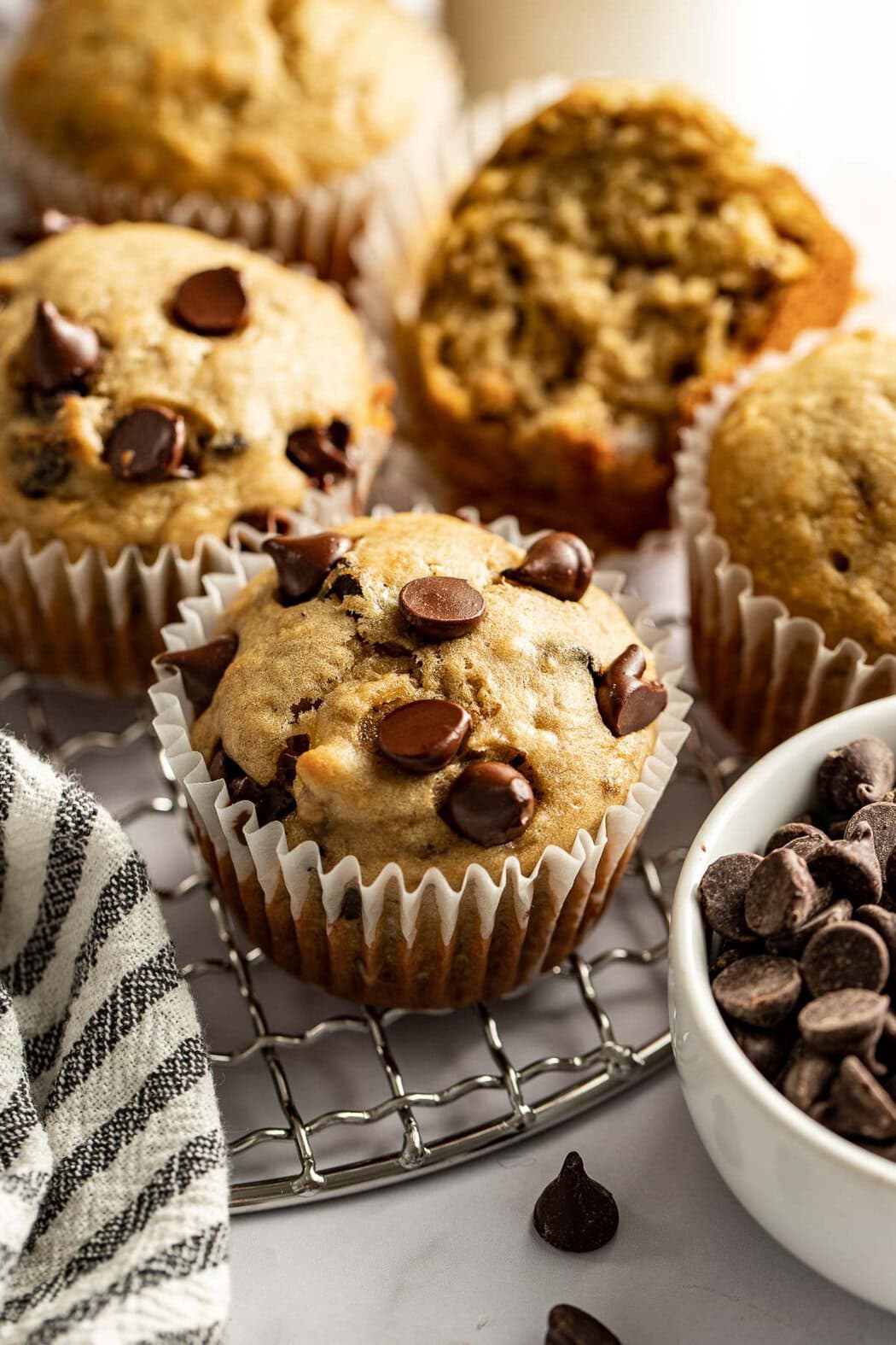 Close up view of freshly baked Gluten-Free Banana Muffins with chocolate chips on top. 