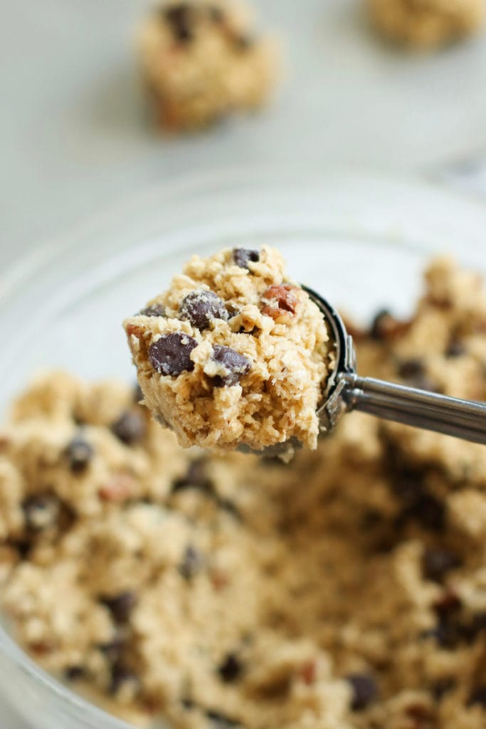 A scoop of oatmeal chocolate chip cookie dough in a scooper