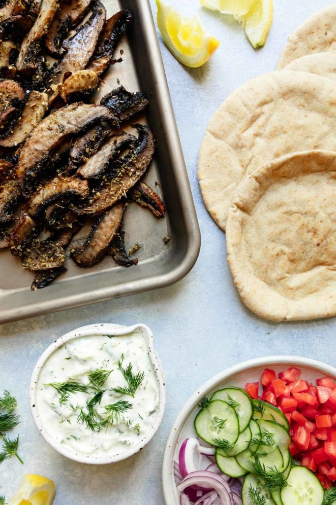 All ingredients for Greek Gryos including crispy roasted mushrooms and homemade tzatziki sauce