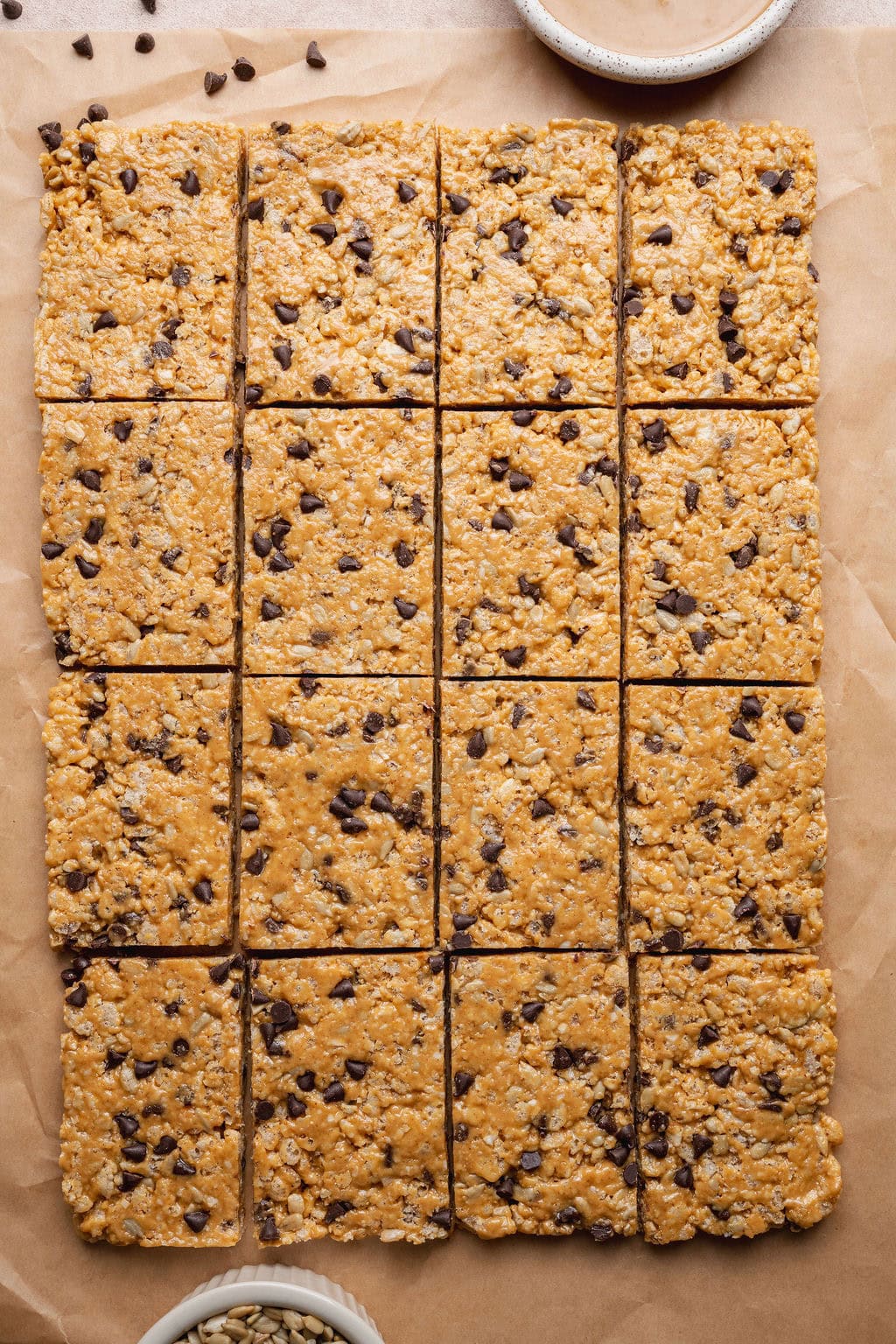 Sliced homemade Clif bars on a sheet of parchment paper.
