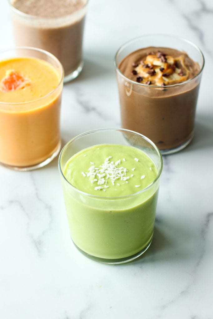 Close up view of a variety of smoothies in glasses. 