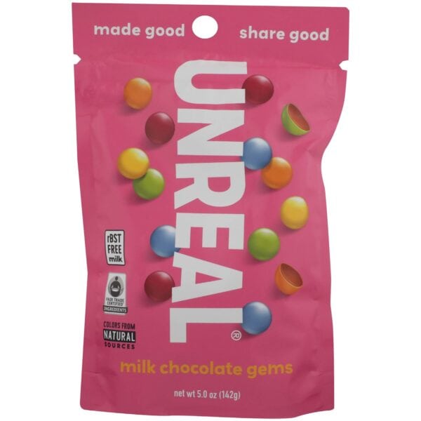 Pink bag of candy coated chocolate pieces with branding from Unreal on bag.