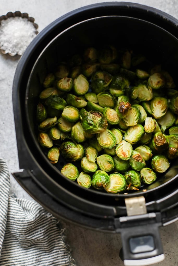 Roasted brussels sprouts in an air fryer basket