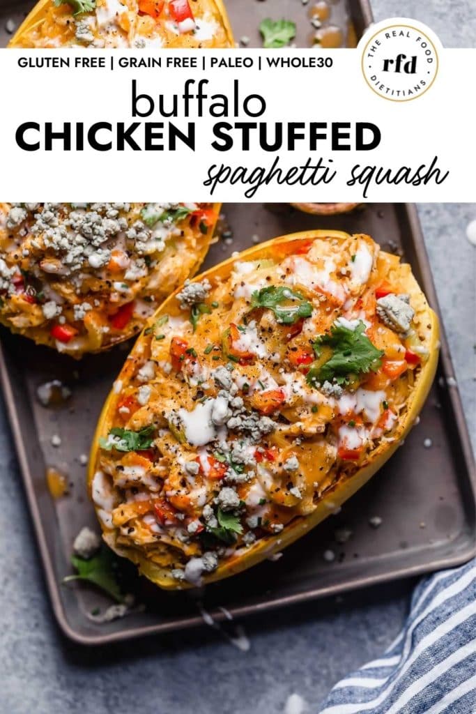Buffalo Chicken Stuffed Spaghetti Squash topped with blue cheese crumbles and fresh herbs.