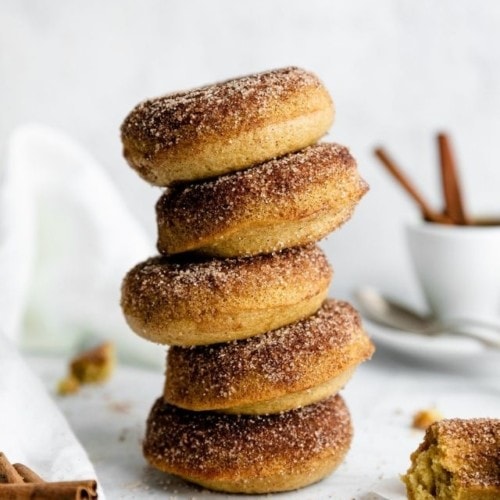 A tall stack of gluten-free cinnamon sugar donuts