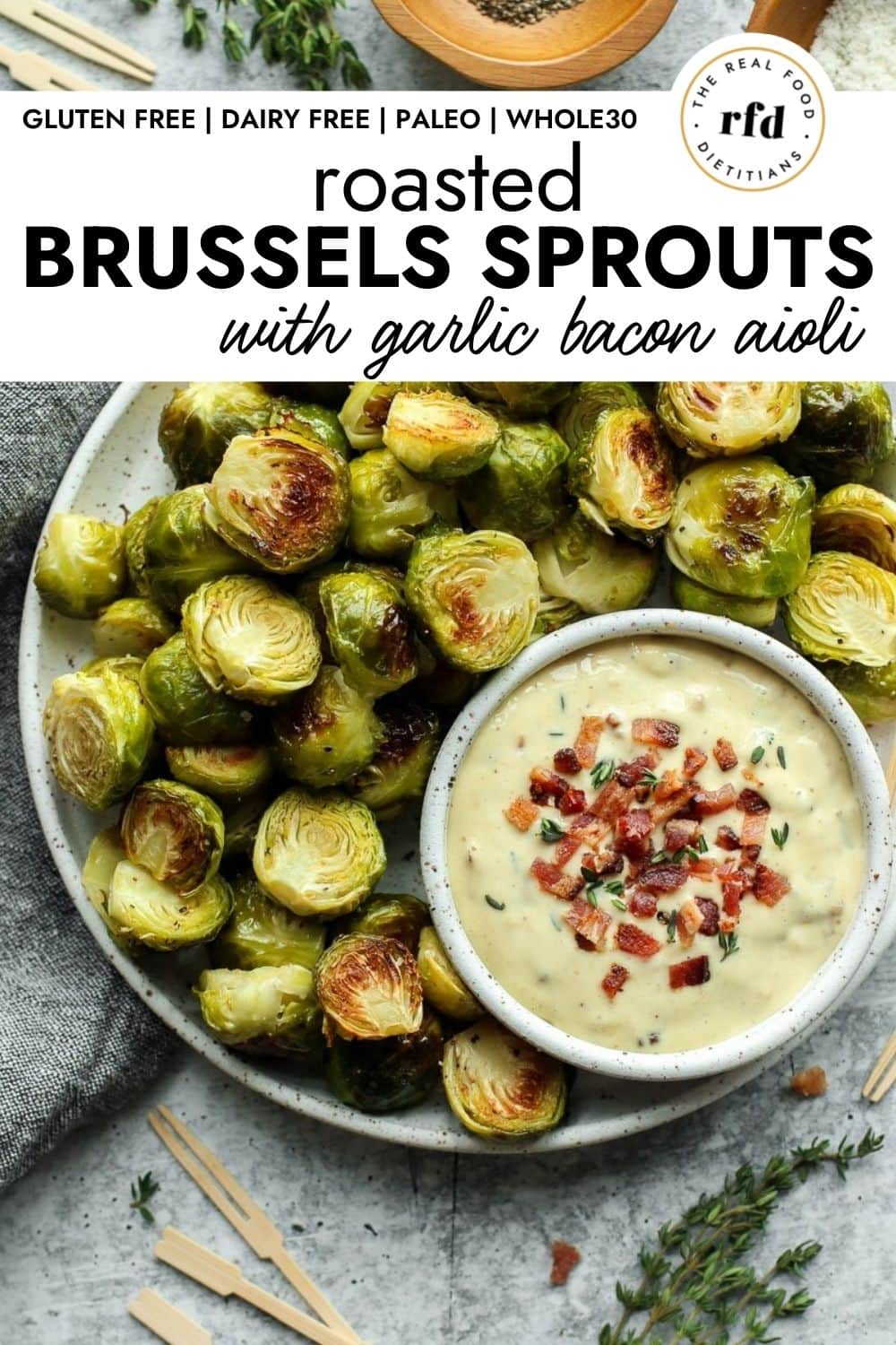 https://therealfooddietitians.com/wp-content/uploads/2021/10/Roasted-Brussels-Sprouts-with-Garlic-Bacon-Aioli-1000-x-1500-px.jpg