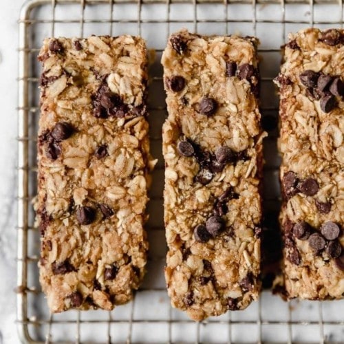 Healthy Peanut Butter Granola Bars with mini chocolate chips lined up on a cooling rack