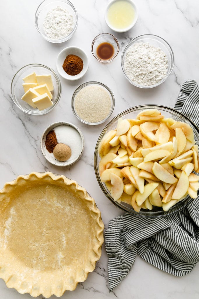 All ingredients for gluten-free apple pie in bowls