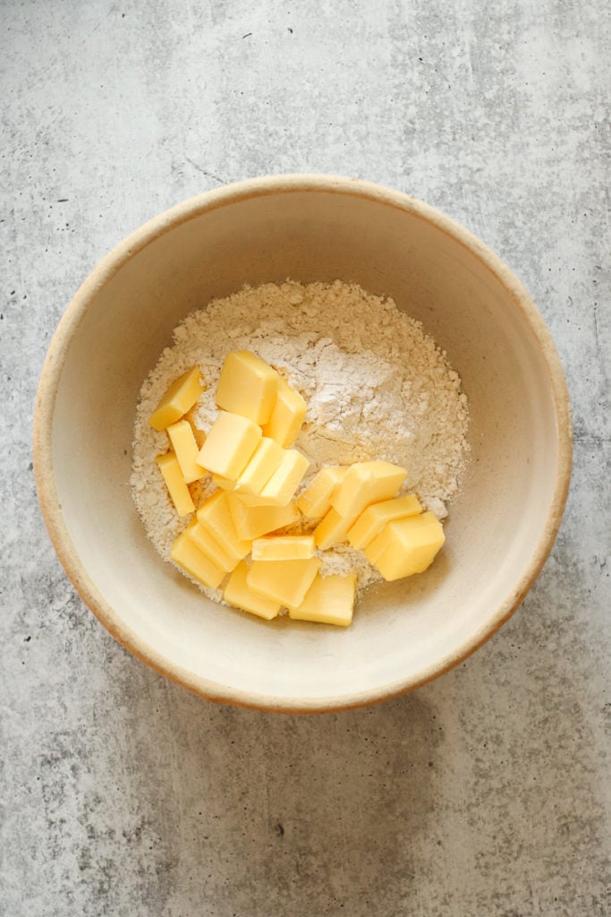 Flour and cut butter in a mixing bowl.