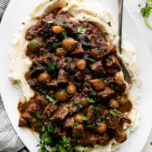 beef tips with gravy served over mashed potatoes