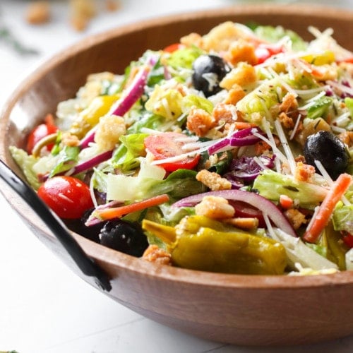 Copycat Olive Garden Salad in a wooden bowl.