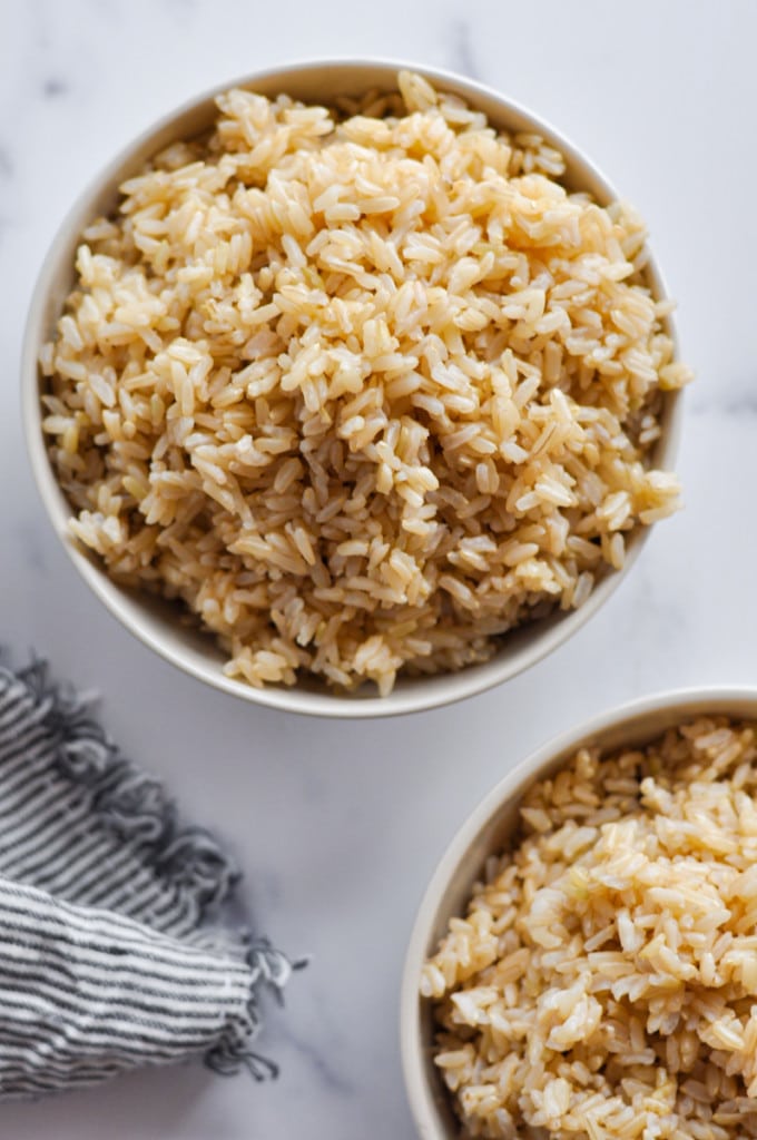 Overhead view cooked brown rice in small bowl
