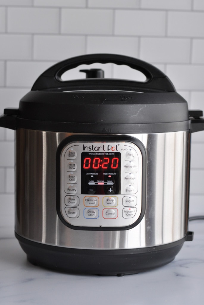An Instant Pot with pressure cook time of 20 minutes on the timer