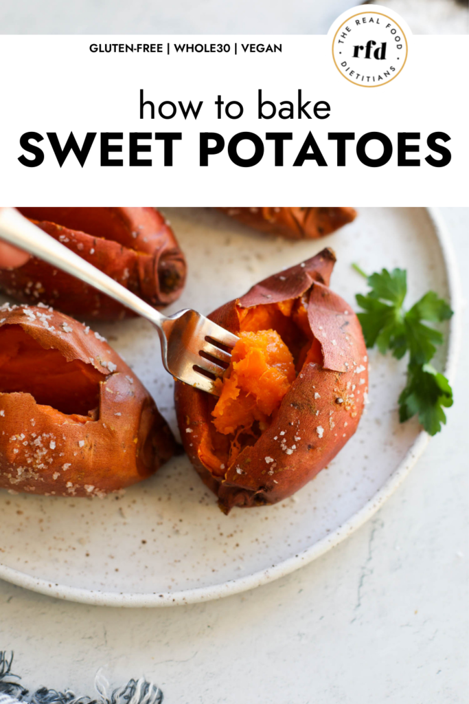 Four oven baked sweet potatoes on a speckled plate, cut lengthwise, with a fork lifting out a small serving of orange sweet potato.