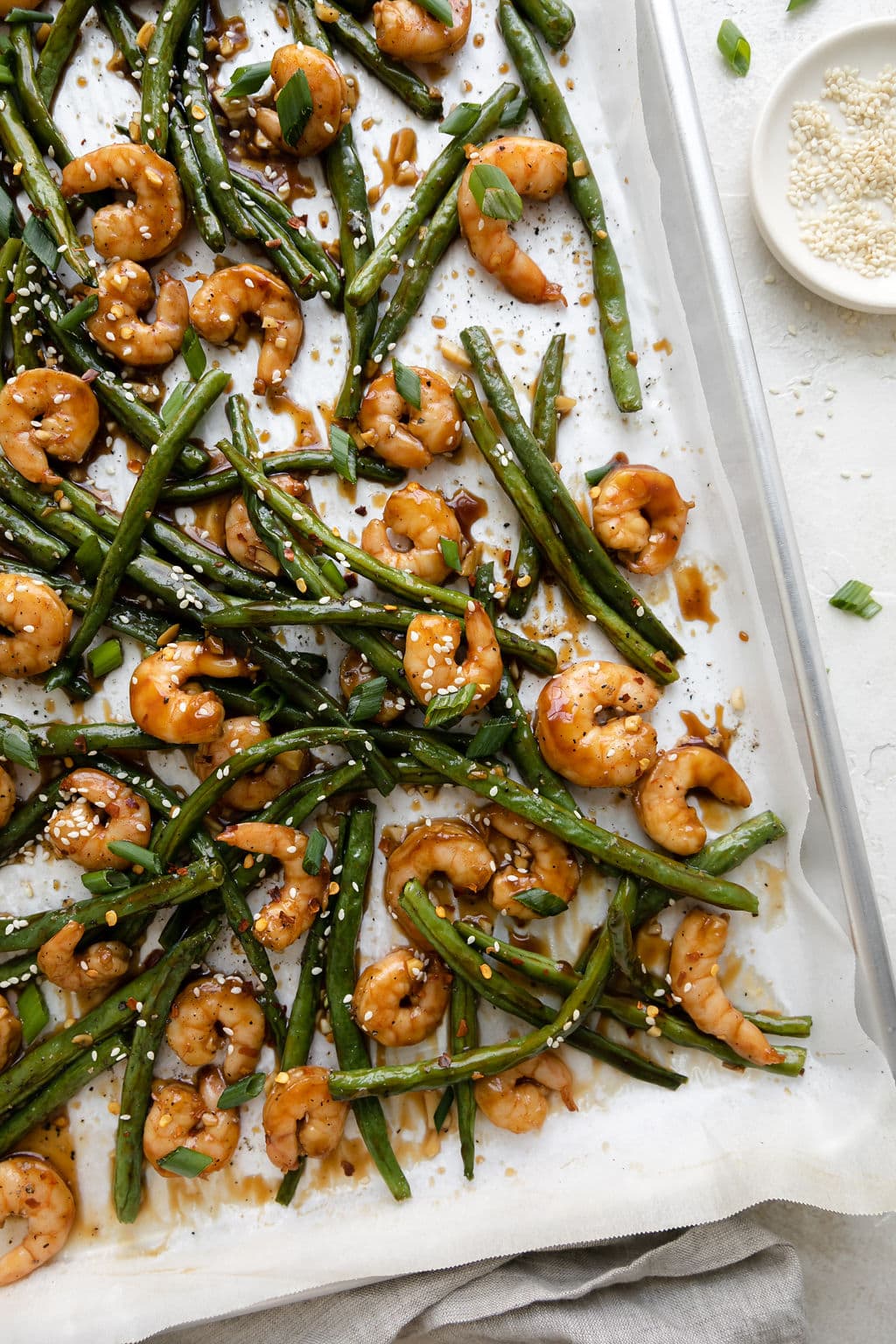 A sheet pan filled with Honey Garlic Shrimp and green beans