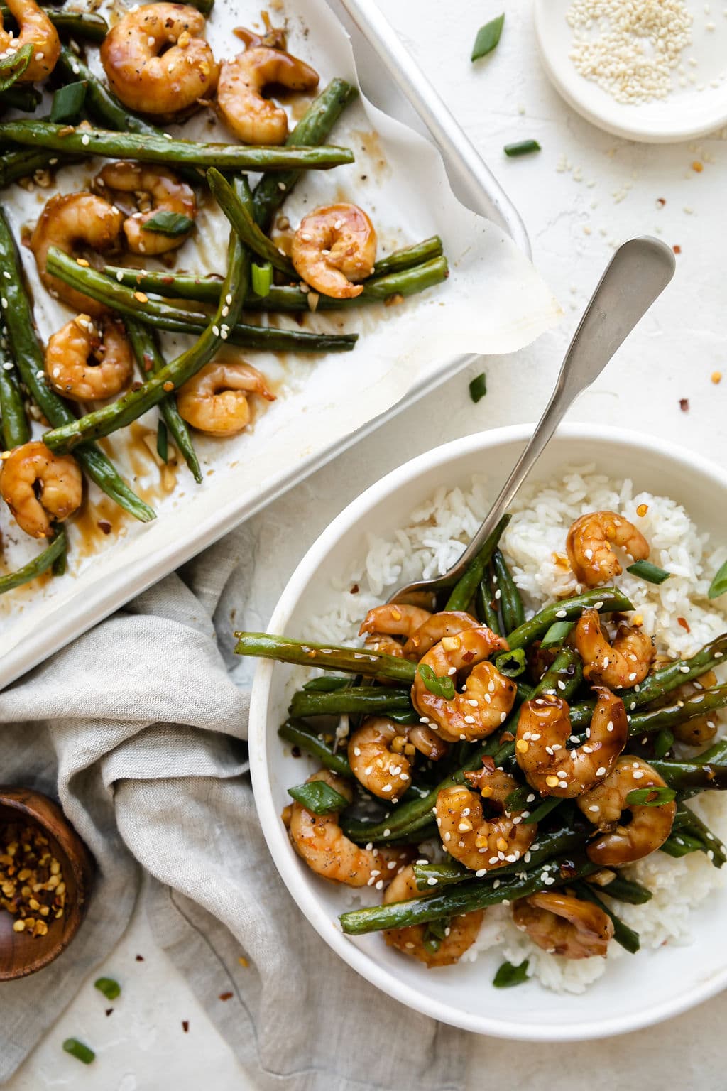 Sheet Pan Honey Garlic Shrimp Dinner on a bowl and on a sheet pan