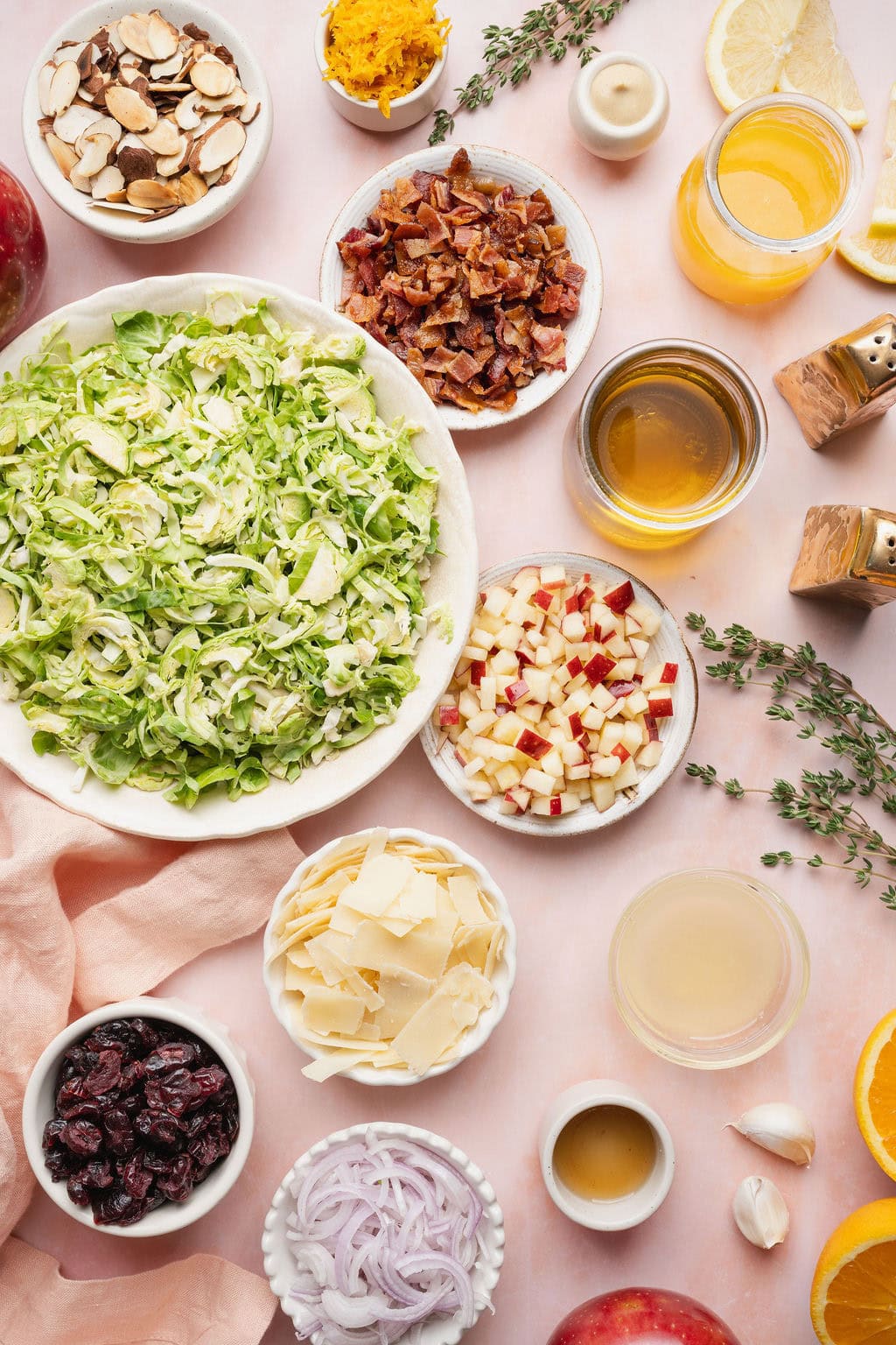 Ingredients to make a shaved Brussels sprouts salad with citrus vinaigrette.