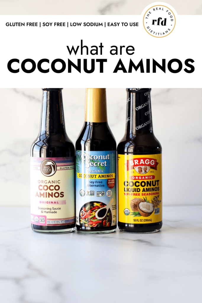 Three glass bottles of coconut aminos in three different brands.