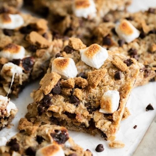 Close up view chewy s'mores granola bars cut into squares.