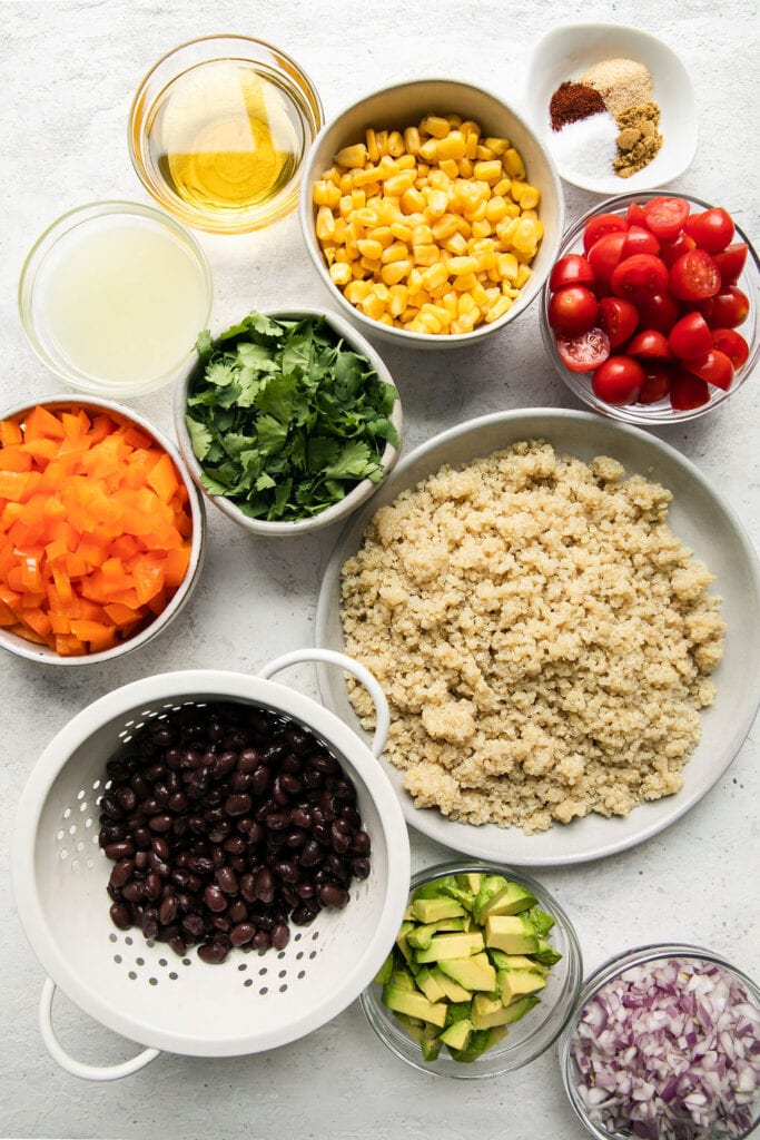 All ingredients for Tex-Mex Quinoa Salad arranged together in small bowls.
