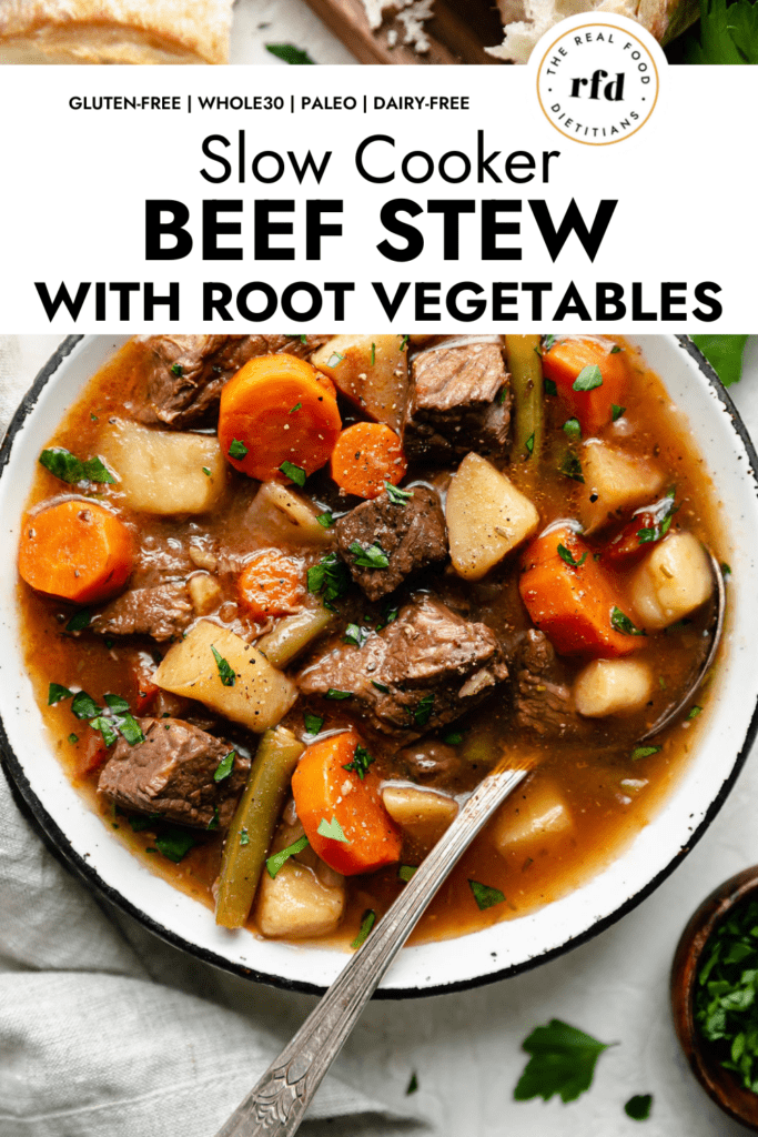 Overhead view rustic bowl filled with slow cooker beef stew with potatoes, parsnips and carrots. 