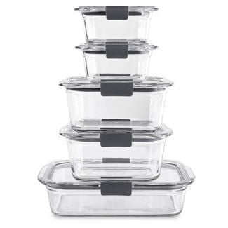 Glass storage container with lids stacked on each other.