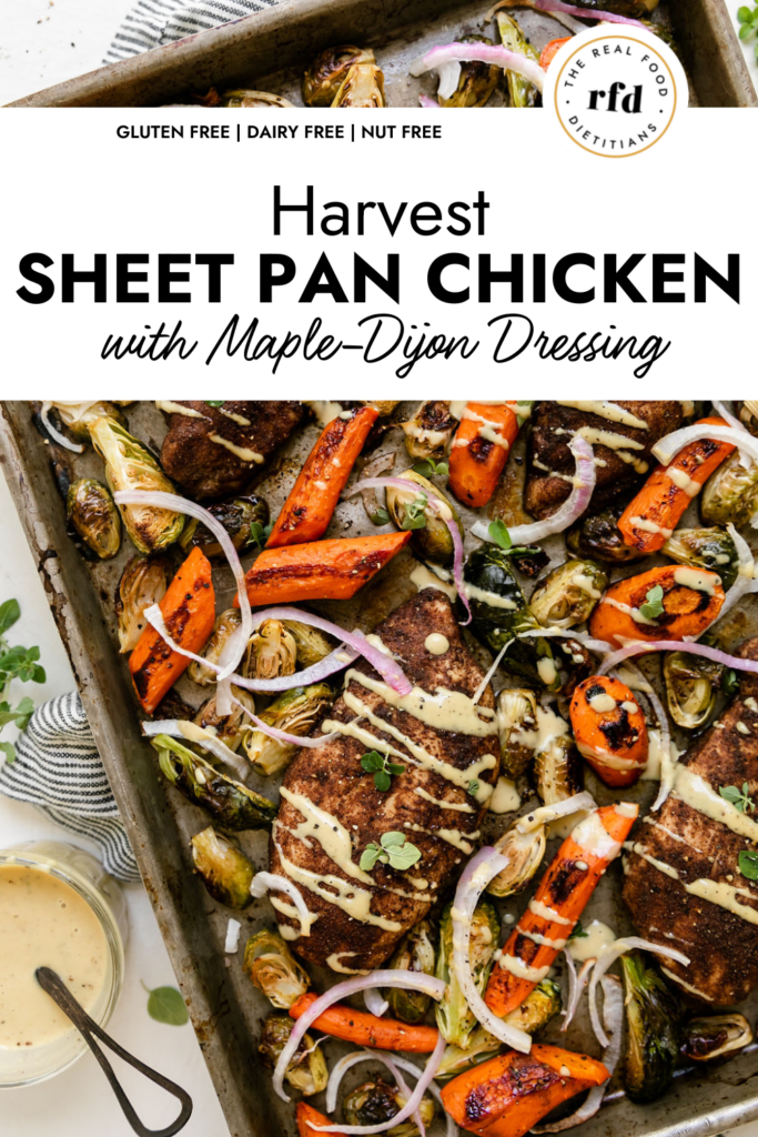 Overhead view sheet pan filled with seasoned chicken breasts, roasted veggies and drizzled with maple dijon dressing.