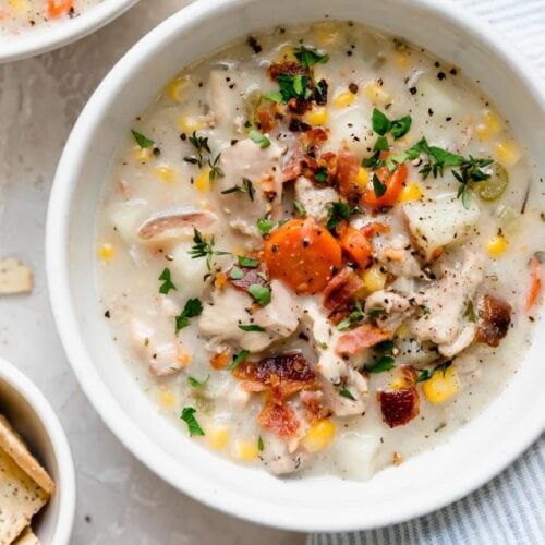 Overhead view white bowl filled with slow cooker chicken corn chowder