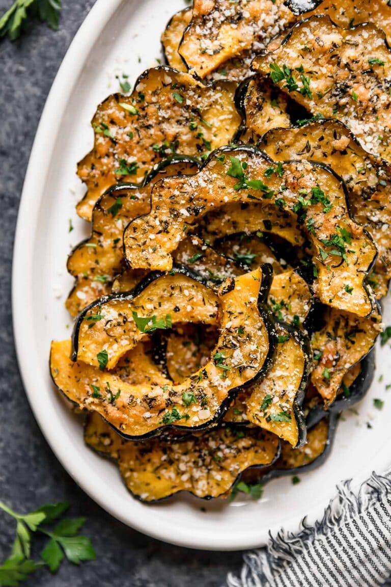 A variety of vibrant fall side dishes including roasted carrots, vegetable gratin, and grilled squash, perfect for autumn meals.