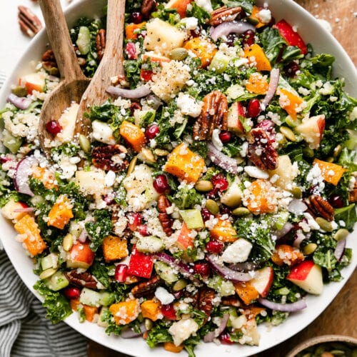 Overhead view white serving bowl filled with harvest quinoa salad with butternut squash