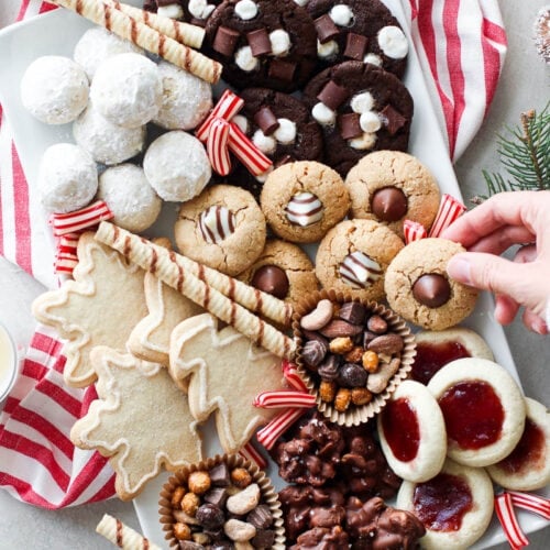 A white tray filled with Christmas cookies and treats