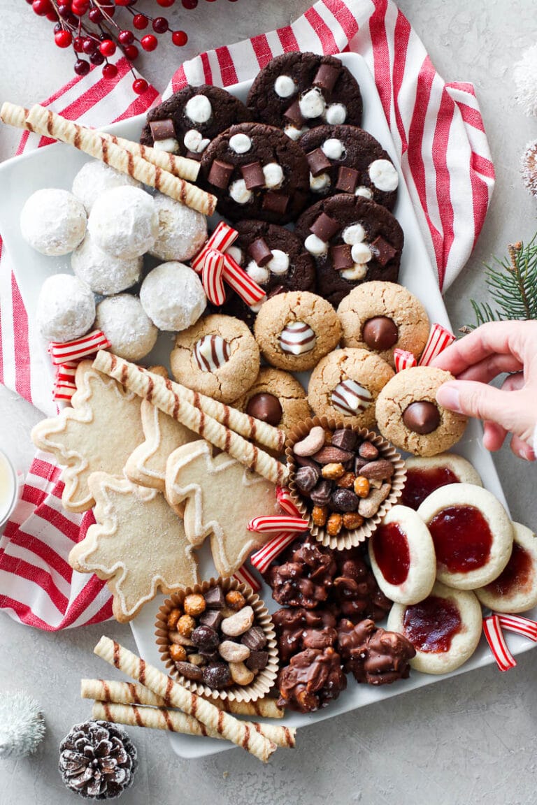 A white tray filled with Christmas cookies and treats