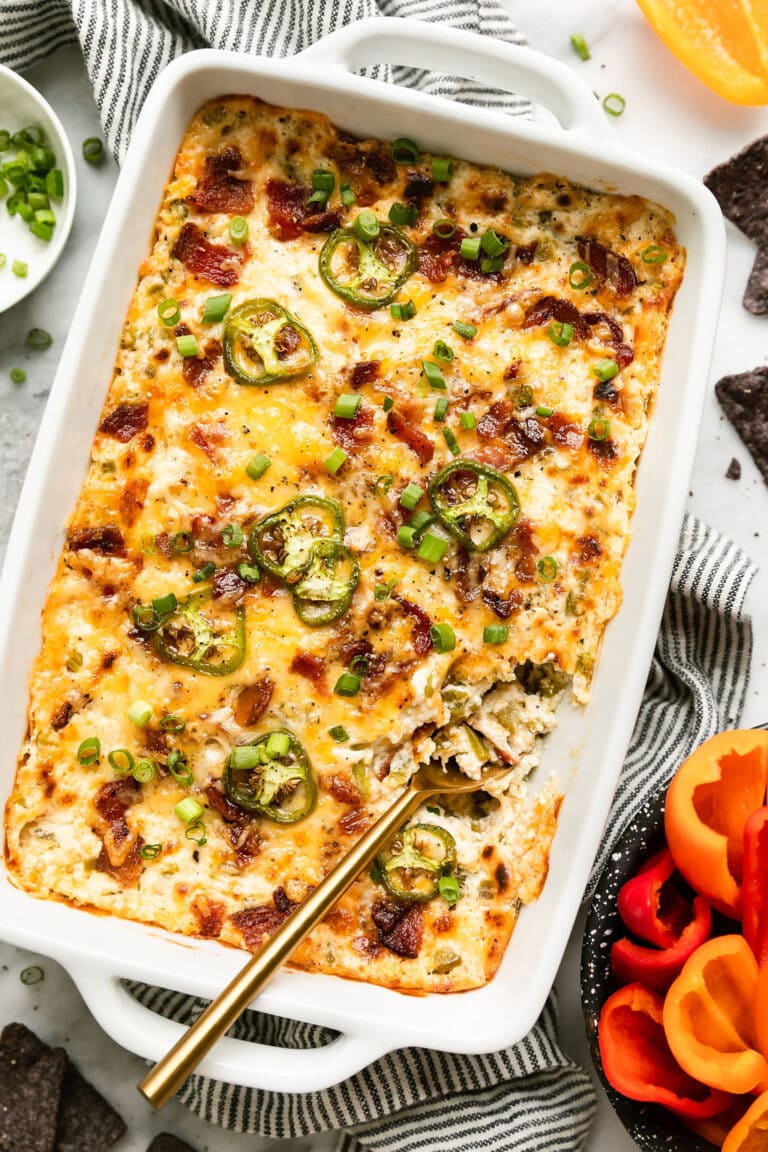 white baking dish filled with jalapeno popper dip