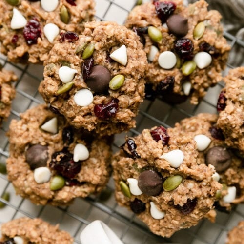 Overhead view Trail Mix Breakfast Cookies with white chocolate chips and dried cranberries on wire cooling rack.