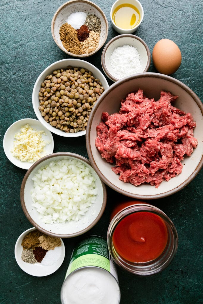 All ingredients for saucy beef and lentil meatballs in bowls