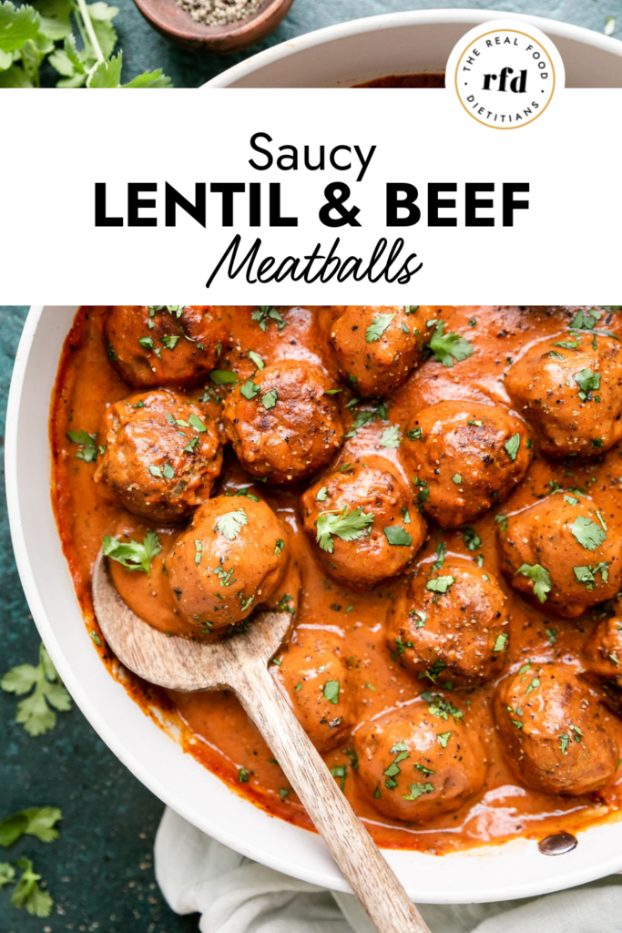 Overhead view beef and lentil meatballs coated in sauce in skillet.