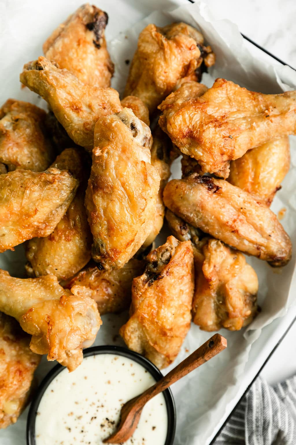 Golden cooked and crispy chicken wings out of the air fryer