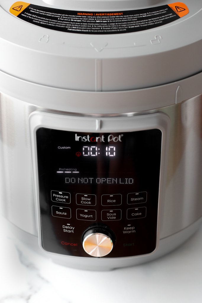 Front of instant pot with 10 minutes natural release for sweet potatoes
