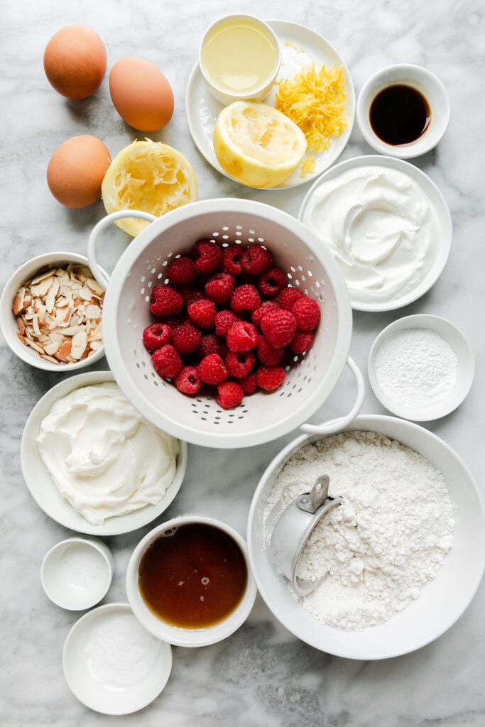 All ingredients for raspberry lemon coffee cake in small bowls.