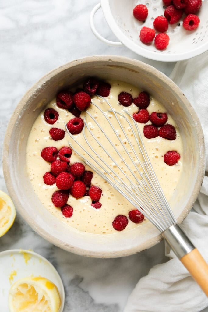 Raspberry lemon coffee cake batter being whisked together in bowl