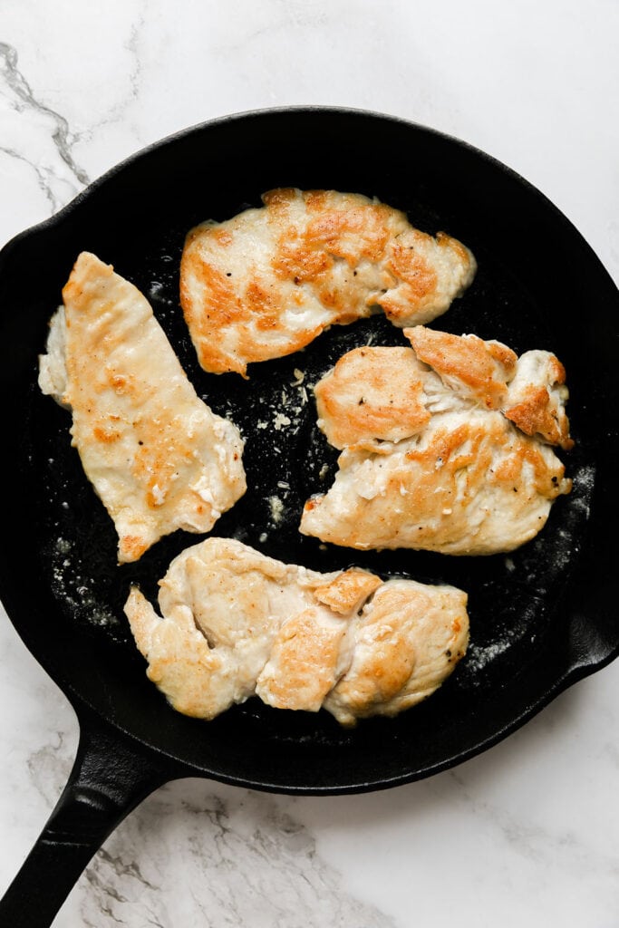 Skillet cooked chicken breasts in cast iron skillet