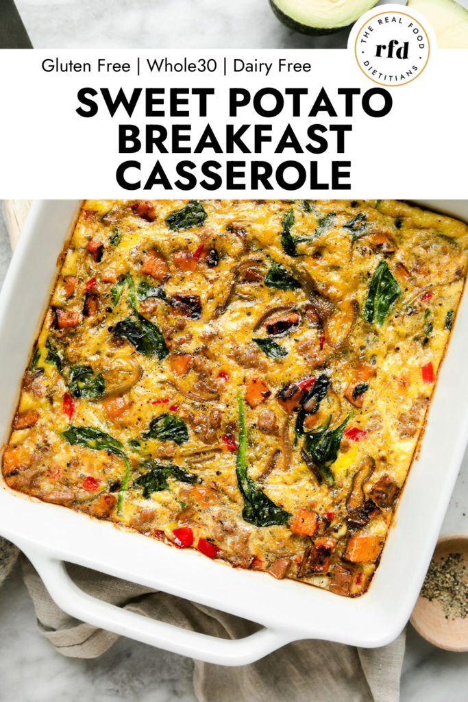 Overhead view baked sweet potato breakfast casserole with sausage and spinach in white baking dish
