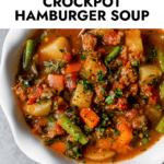 Close up overhead view hamburger soup in white bowl