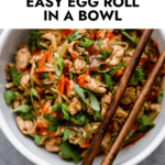 Egg Roll in a Bowl served in a white bowl with chopsticks resting on bowl edge.