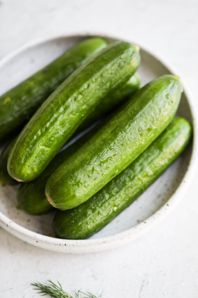 A small variety of cucumbers, washed and ready to be prepped.