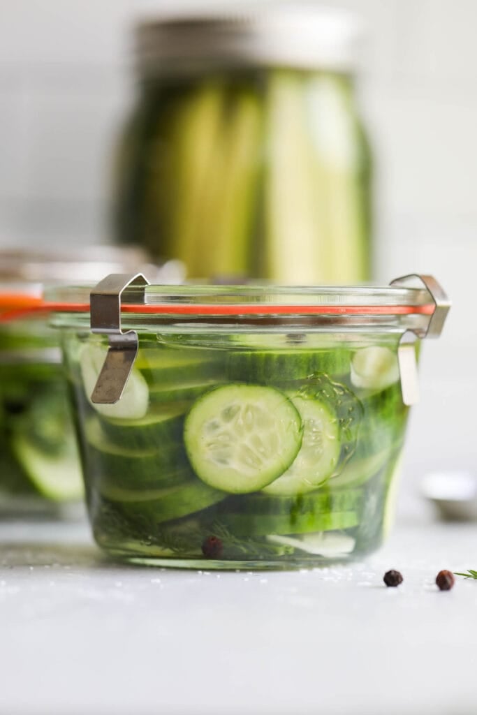 An airtight contain of refrigerator pickle chips, ready to be eaten. 